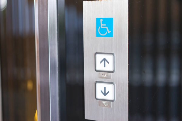 Image showing up and down buttons on the outside of a lift